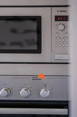 a microwave oven with the words herikelandauts on it at #092 Quinta dos Figos by Home Holidays in Albufeira