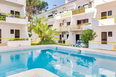 a swimming pool in front of a building at AL - Apartamento Sol Nascente 1 Top Floor in Quarteira