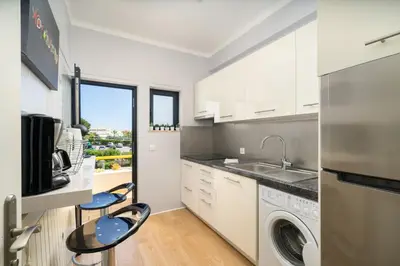 a kitchen with a sink and a dishwasher at AL - Apartamento Sol Nascente 1 Top Floor in Quarteira