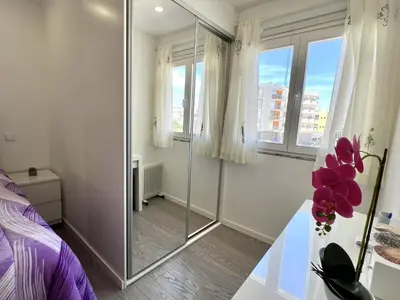 a bedroom with a glass walk in shower at Nutmeg - 50mtrs to beach - by HD PROPERTIES in Quarteira