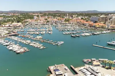 an aerial view of a marina with boats in the water at CATCH - Vilamoura in Vilamoura