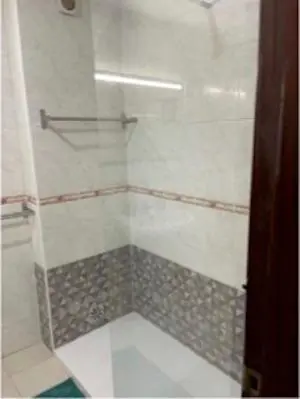 a bathroom with a shower with a glass door at Charming Private Rooms in an Apartment A2 Penha - Faro in Faro