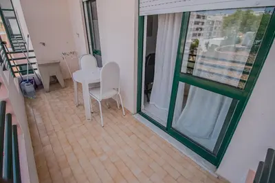 a room with a table and chairs and a window at Charming Private Rooms in an Apartment A1 Penha - Faro in Faro