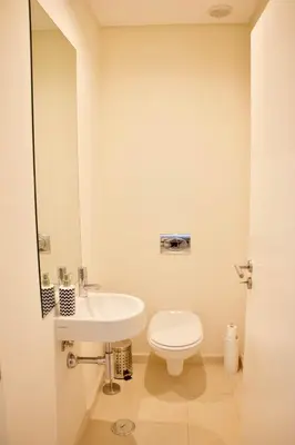 an electronic machine with a button on the side of it at Victoria Gardens Luxury Apartment by PA Hotels in Quarteira