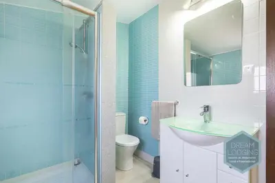a bathroom with a toilet and a sink and a shower at Villa Rafaella 3 - Dream Lodging in Albufeira