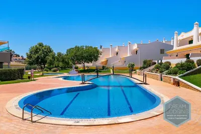 a swimming pool in front of a large house at Villa Rafaella 3 - Dream Lodging in Albufeira