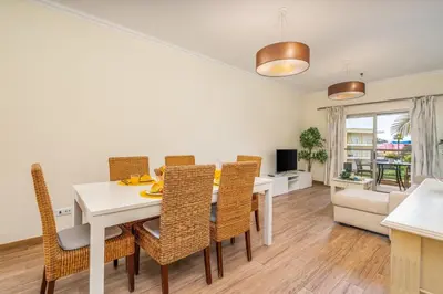 a bedroom with two beds and a desk in it at #010 Marina by Home Holidays in Albufeira