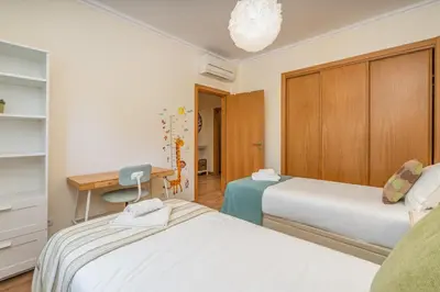 a bathroom with a sink and a mirror at #010 Marina by Home Holidays in Albufeira