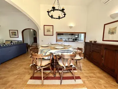 a dining room with a table and chairs at Vila Santo Antonio - Vilamoura by HD PROPERTIES in Vilamoura