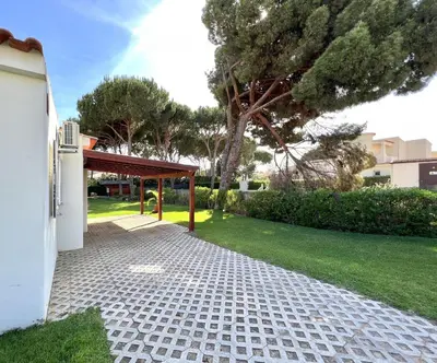 a brick walkway with a pavilion in a yard at Vila Santo Antonio - Vilamoura by HD PROPERTIES in Vilamoura