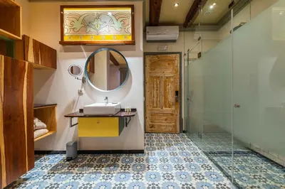 a bathroom with a sink and a mirror at Vila Origens Boutique Hotel Albufeira – Adults Only in Albufeira