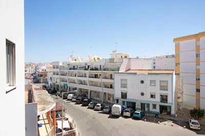 an overhead view of a city street with parked cars at Quarteira Beach iii in Quarteira