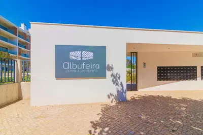 a building with a sign on the side of it at Marvell Design with heated pool&Playground in Albufeira