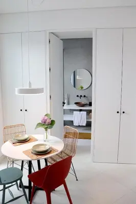 a dining room with a table and chairs at Arty Casa in Faro