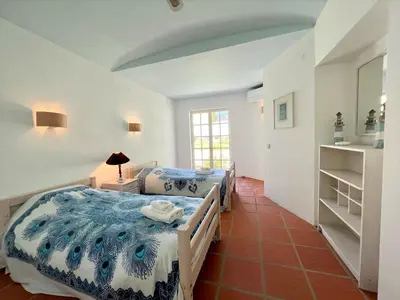 a bedroom with two beds in a room at Albufeira Balaia Villa With Private Pool by Homing in Albufeira