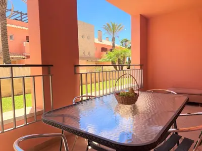 a table with a bowl of fruit on a balcony at Vilamoura Victoria Gardens With Pool by Homing in Vilamoura