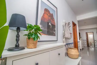 a lamp and a plant on a dresser in a room at Apartment close to golf, beaches, Quinta Lago, Vale Lobo, Quarteira and Vilamoura in Quinta do Lago