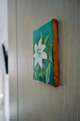 a painting of a white flower on a wall at Eleven, Boutique luxury house & garden in Boliqueime