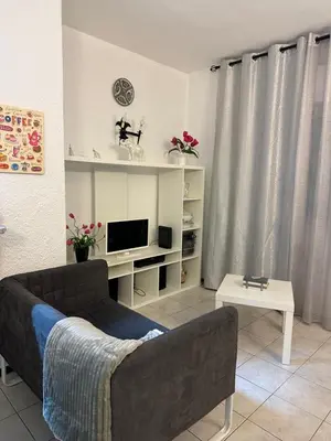 a bathroom with a toilet and a shower and a sink at Quarteira Home Beach Férias Tranquilas a 1KM da Praia Totalmente Renovado in Quarteira