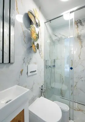 a bathroom with a shower and a toilet and a sink at Medusa Luxury Marina in Vilamoura