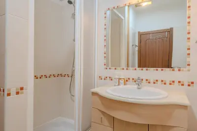 a bathroom with a sink and a shower at #014 Mar & Praia Albufeira by Home Holidays in Albufeira