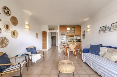 a living room with a table with fruit on it at #014 Mar & Praia Albufeira by Home Holidays in Albufeira