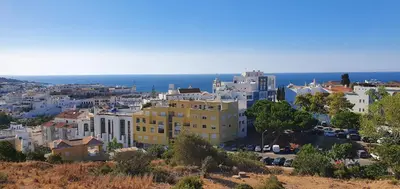 a view of a city with buildings and the ocean at Apartamento Solaris T1 - Férias Albufeira in Albufeira