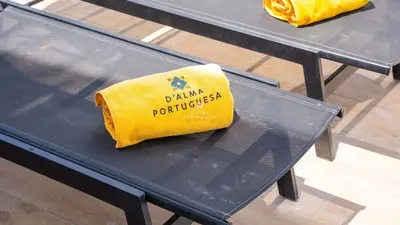 a yellow bag sitting on top of a table at Villa Girassol - By Dalma Portuguesa in Albufeira