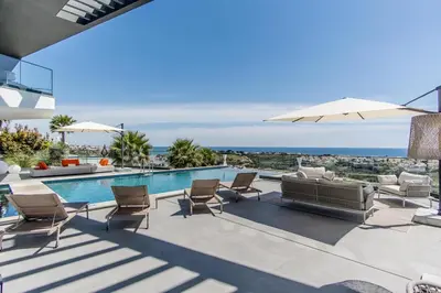 a gym with treadmills and cardio equipment in a room at Villa Luxueuse Vue Mer in Albufeira