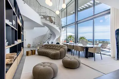 an overhead view of a living room with a table and a chair at Villa Luxueuse Vue Mer in Albufeira