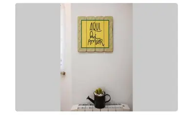 a picture hanging on a wall above a stove at BeGuest Casetta Cleo in Páteo