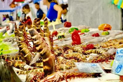 a bunch of seafood on display at a market at Bright Modern Beachside Apartment with Pool & Seaview in Quarteira