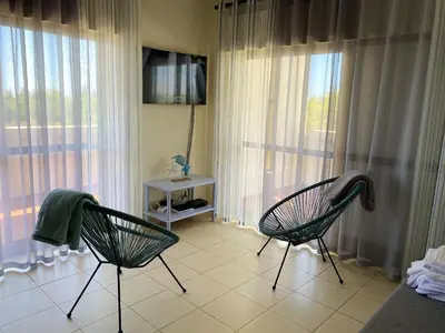 two beds sitting next to each other in a bedroom at Charming Vilamoura Apartment with Shared Pool in Vilamoura