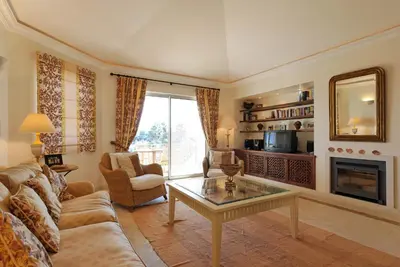 a living room with a couch and a table at Tulio 2 Bedroom Luxury Apartment located in Encosta Do Lago in Quinta do Lago
