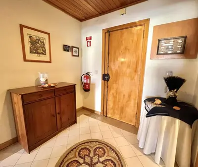 a room with a wooden door and a rug at Talia XII - Near the beach by HD PROPERTIES in Vilamoura