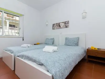 a bedroom with a bed with two pillows on it at Villa Double Joy by Stay ici Algarve Holiday Rental in Albufeira
