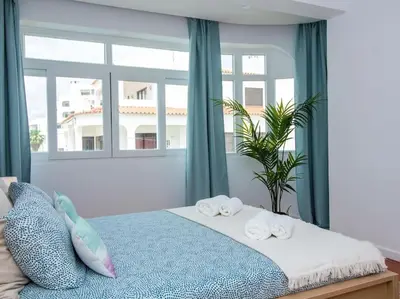 a bedroom with a bed with two towels on it at Villa Double Joy by Stay ici Algarve Holiday Rental in Albufeira