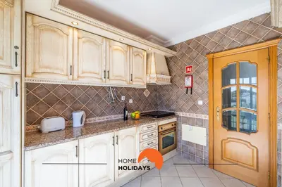 a close up of a wooden door with a sign on it at #020 Medronheira by Home Holidays in Albufeira
