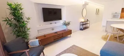 a living room with a tv on a wall at 211 Apartamento moderno com vista para a piscina no centro da cidade in Albufeira