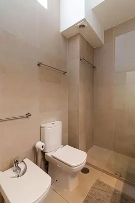 a bathroom with a toilet and a sink and a shower at BmyGuest - Vilamoura Marina's View in Vilamoura