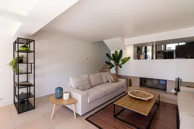 a living room with a white couch and a table at BmyGuest - Vilamoura Marina's View in Vilamoura