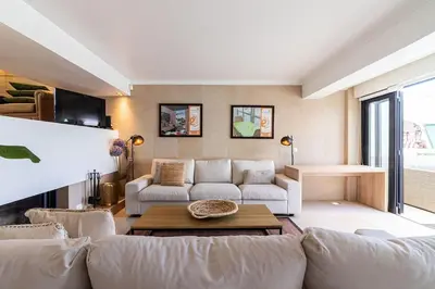 a living room with a couch and a table at BmyGuest - Vilamoura Marina's View in Vilamoura