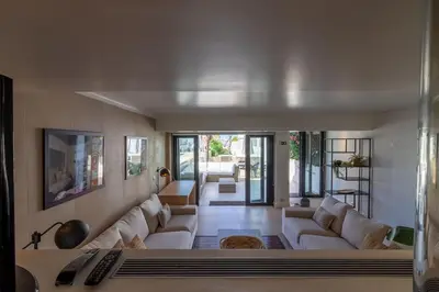 a living room with white couches and a couch at BmyGuest - Vilamoura Marina's View in Vilamoura