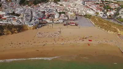 an aerial view of a beach with a crowd of people at City Dacha - Ocean in Albufeira