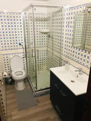 a bathroom with a toilet and a shower and a sink at City Dacha - Ocean in Albufeira