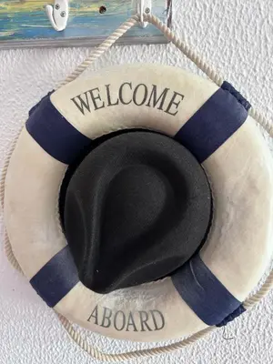a welcome aboard sign hanging on a wall at City Dacha - Ocean in Albufeira