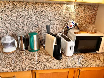 a kitchen counter with appliances on a counter top at City Dacha - Ocean in Albufeira