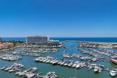 a group of boats docked in a harbor at Marina Views in Quarteira