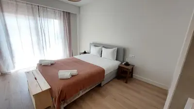 a bedroom with a bed with two towels on it at Forte Novo Beach in Quarteira