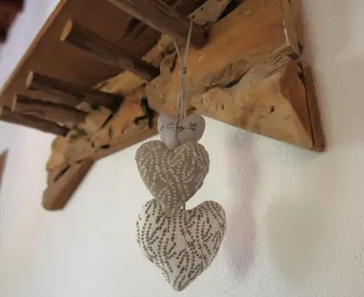 two hearts hanging from the ceiling of a room at Vila Lobo Algarve in Faro